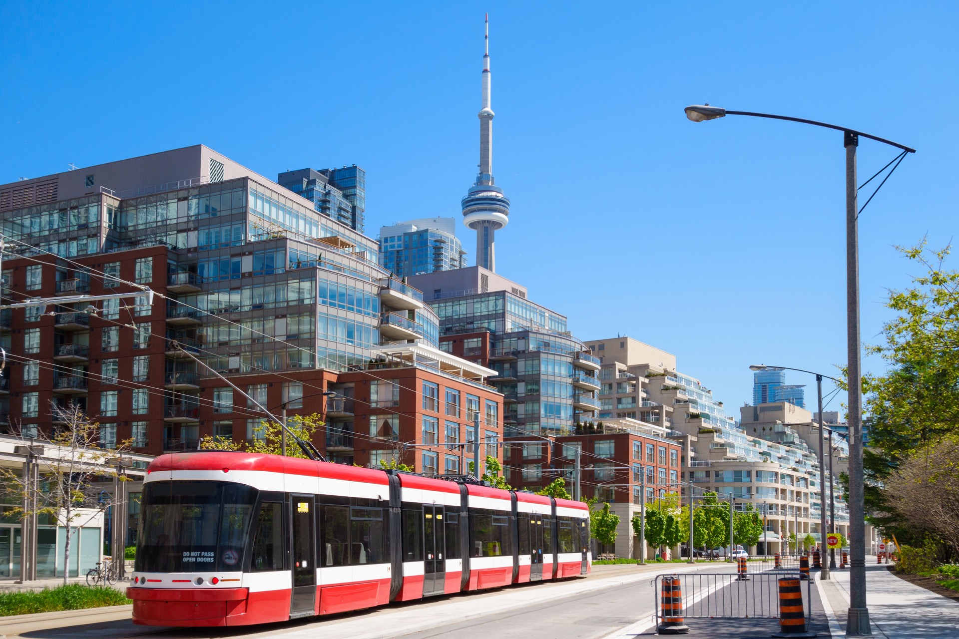 Red Street Car passes condos in Toronto, Canada