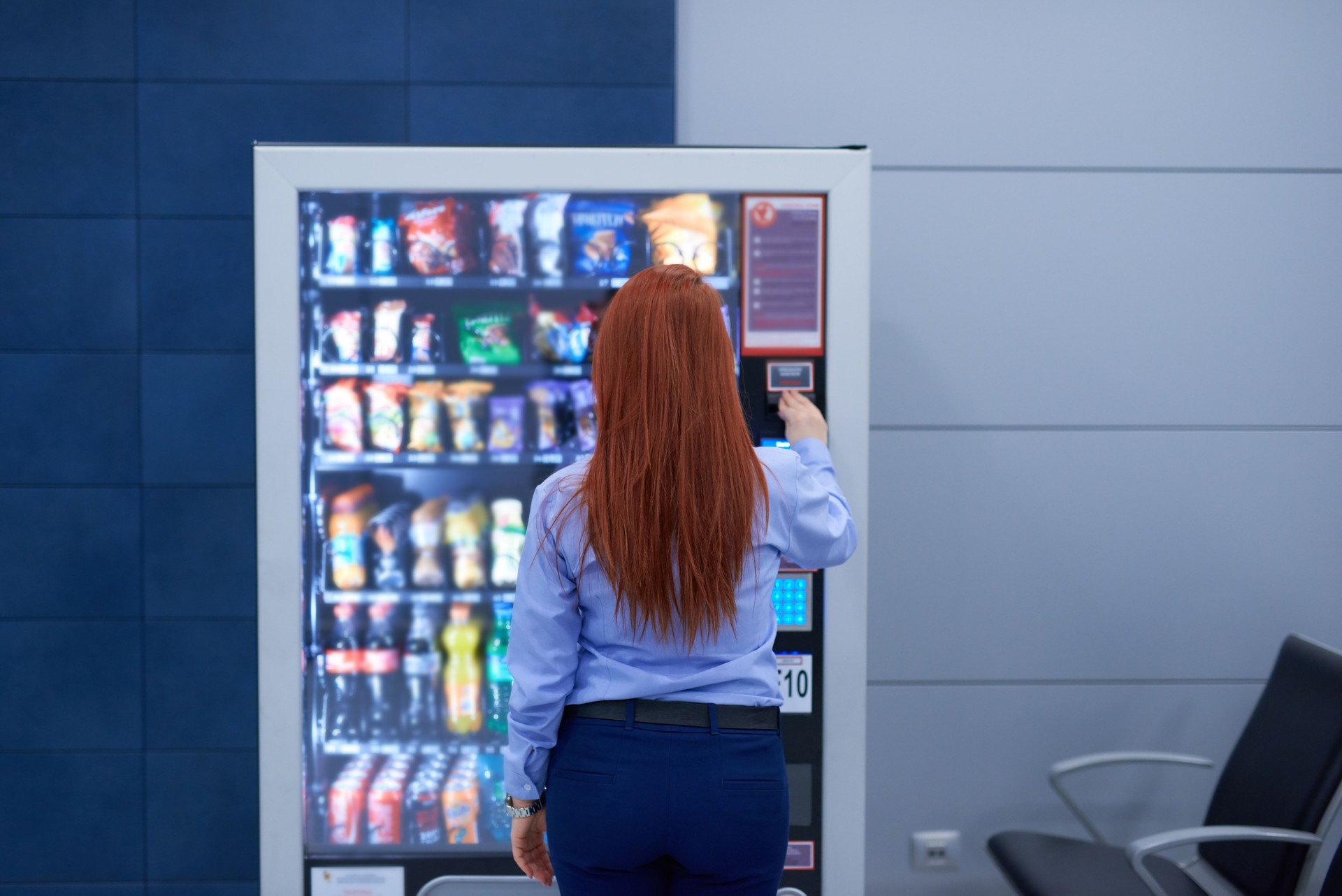 Woman buys snack and drink from eSafe Vending