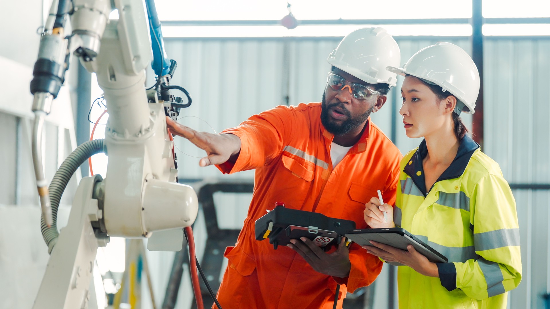 Professional Engineer training and discussing at a Robot Development Plant