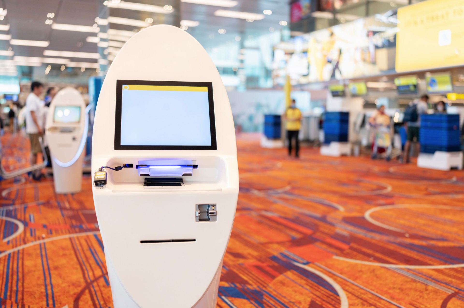 Automatic smart kiosk by eSafe Vending, located at the airport to assist passengers in checking in their flights..